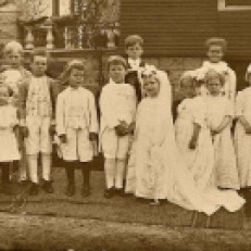 Helen Marie Hoagland, second child on the left side of this photo, was my biological paternal grandmother. She took part in this "Tom Thumb Wedding" in Elgin, Kane County, Illinois.